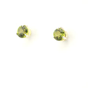 Pair of round green gemstone earrings on a white background