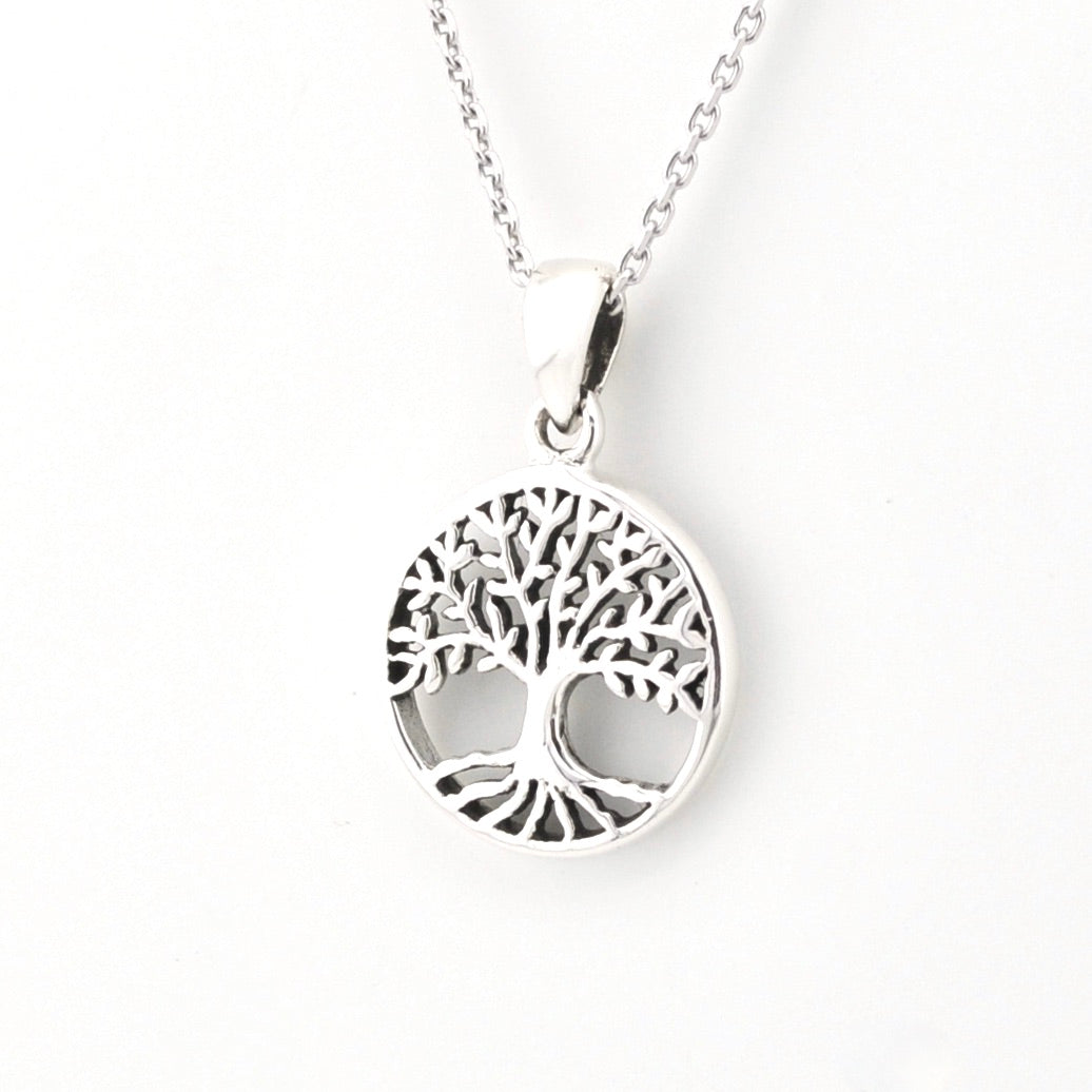 Silver tree of life pendant necklace on a white background