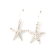 Starfish-shaped earrings on a white background
