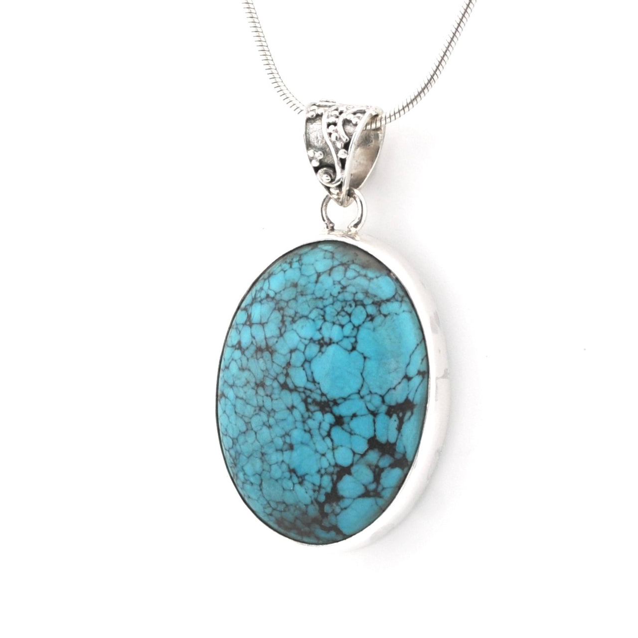An oval turquoise pendant necklace with a silver-toned bezel and chain, shown against a plain white background.
