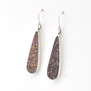 Teardrop-shaped earrings with multicolored stones on a white background