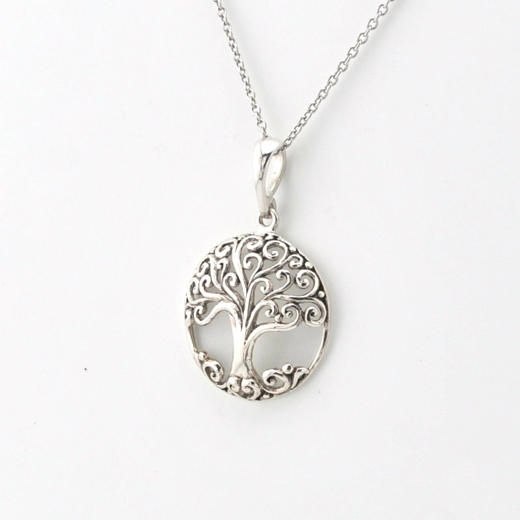 Silver tree of life pendant on a silver chain.