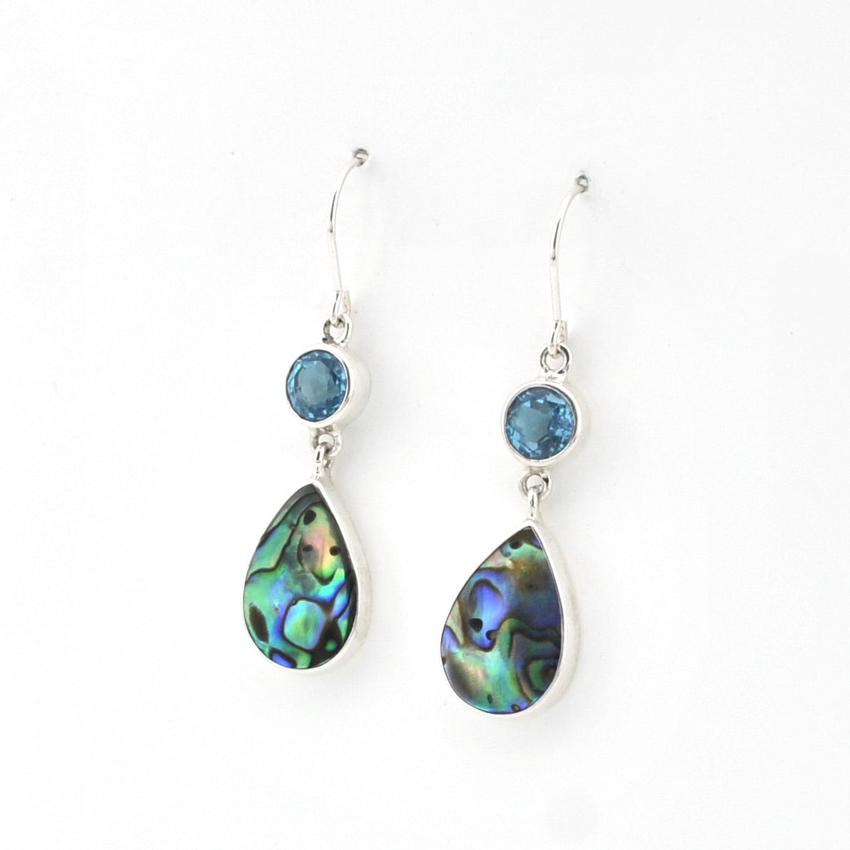 Teardrop-shaped earrings with gemstones on a white background
