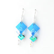 Blue square-shaped earrings on a white background
