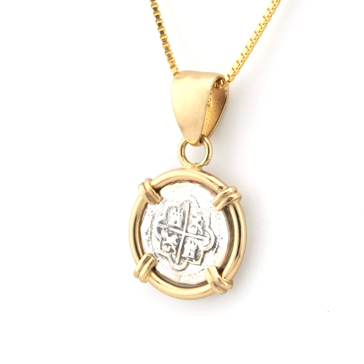 Gold and silver pendant necklace on a white background