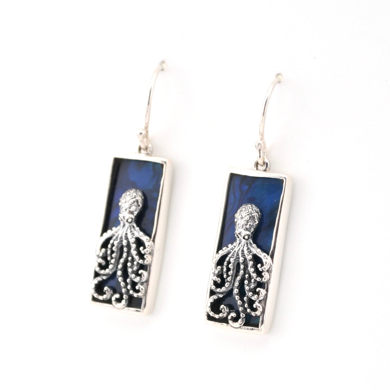 Pair of earrings with octopus design on a blue background