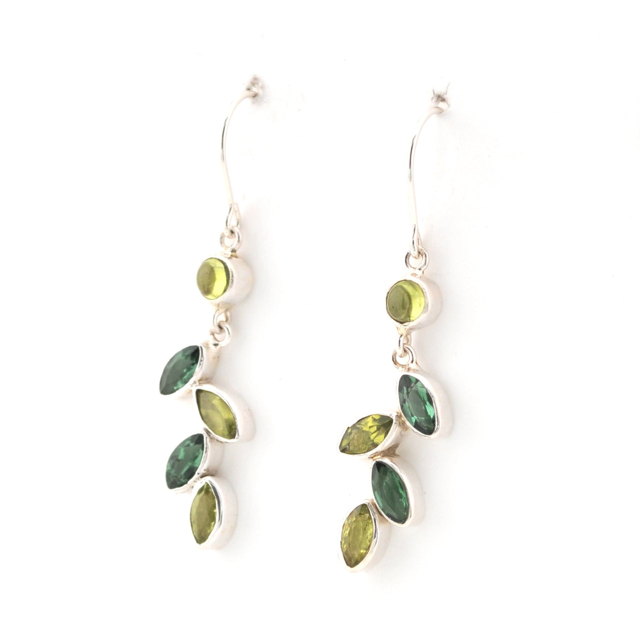 Pair of earrings with green gemstones on a white background