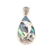 Teardrop-shaped pendant with abalone shell and silver dolphin design on a white background