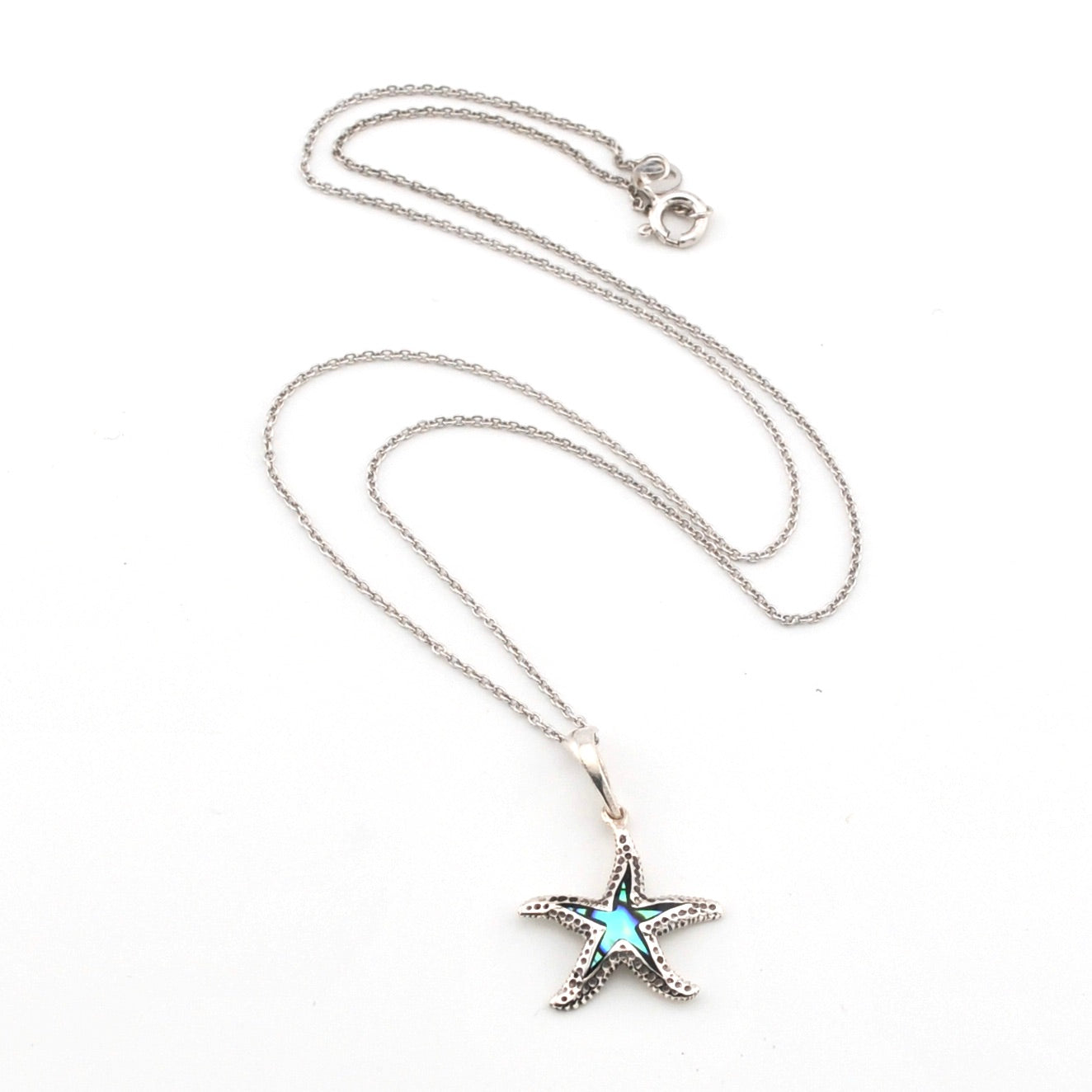 Starfish pendant necklace on a white background