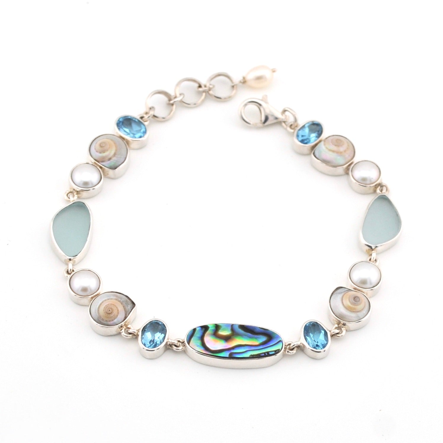 Bracelet with topaz, pearl, sea shell and sea glass on a white background