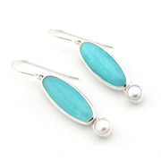 Handmade sterling silver dangle earrings with amazonite and pearl on white background