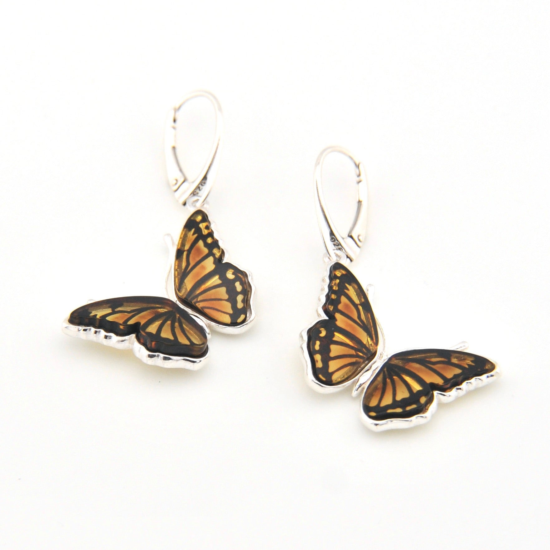 Butterfly-shaped earrings on a white background