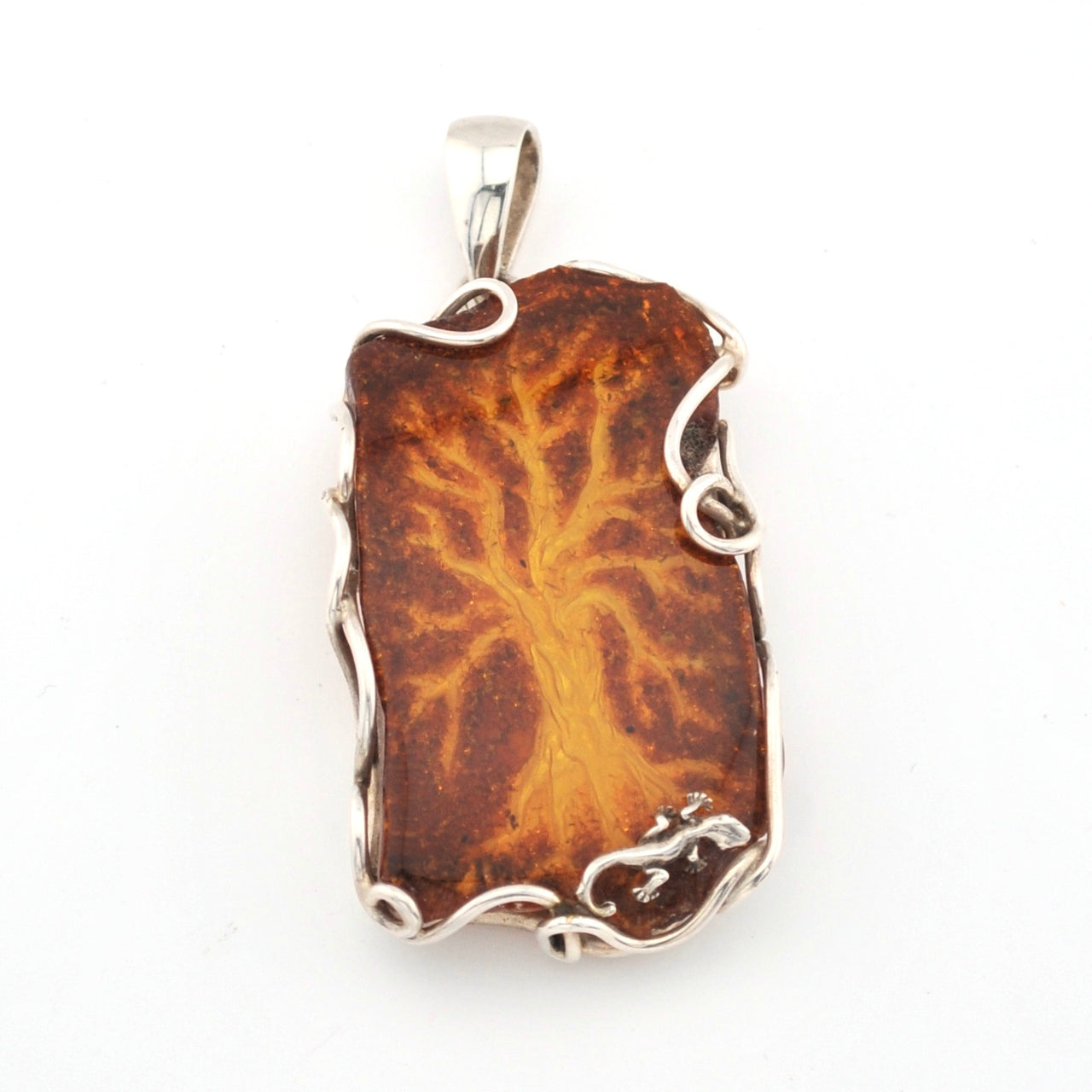 Brown pendant with silver frame on a white background