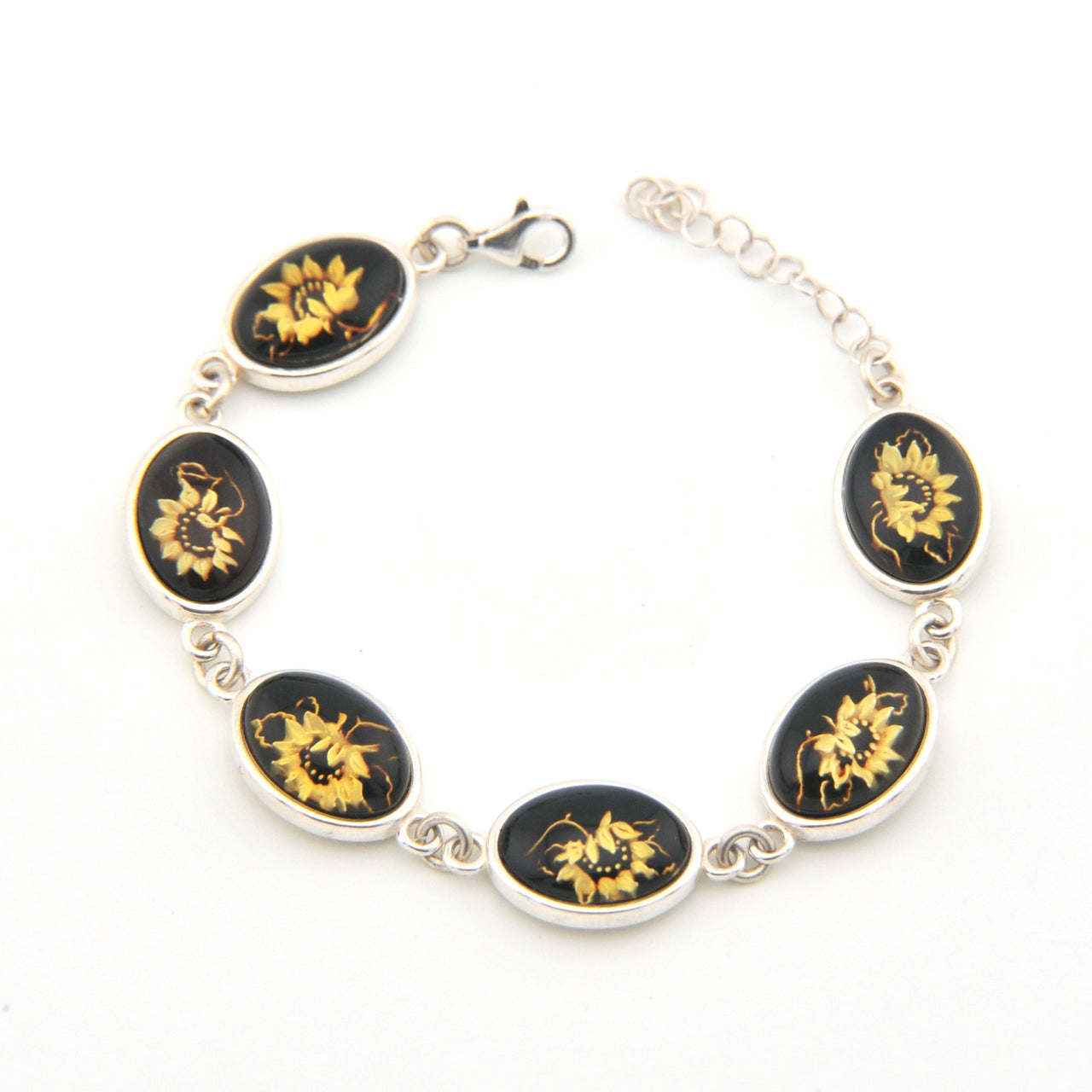 Bracelet with black and gold sunflower designs on a white background