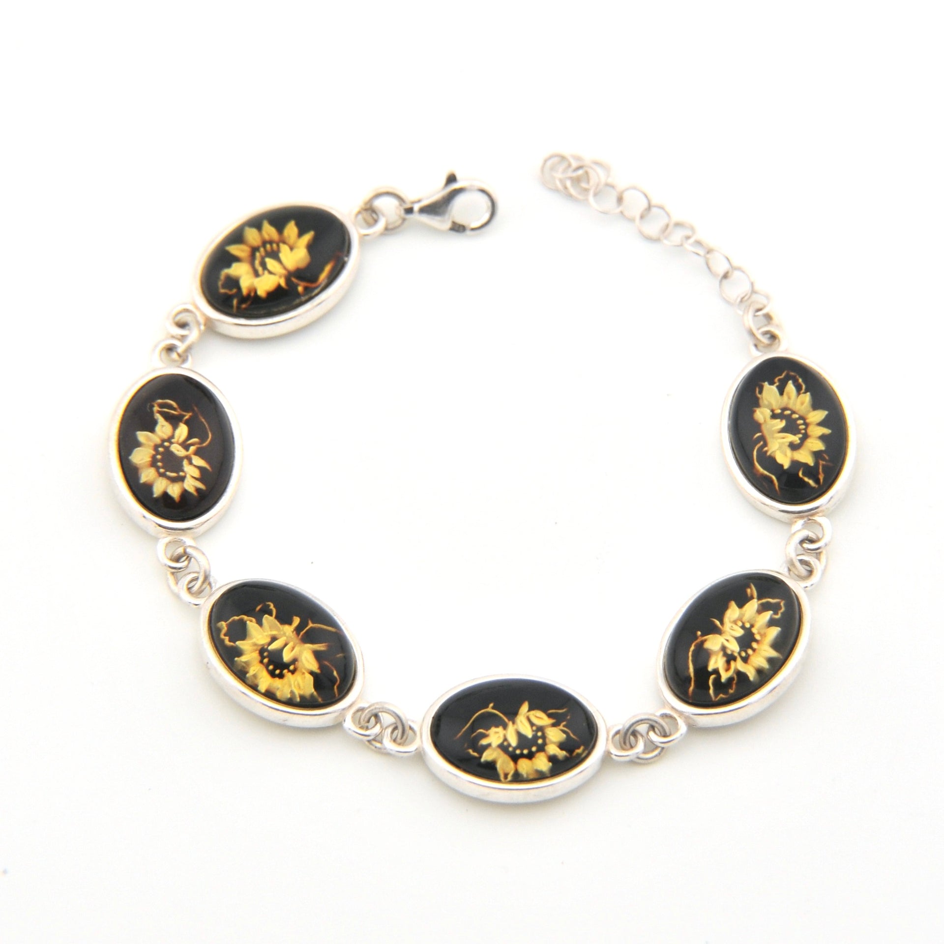 Bracelet with black and gold sunflower designs on a white background