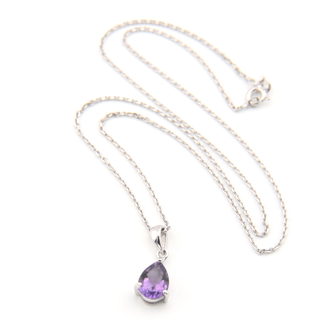 Necklace with a purple teardrop pendant on a white background