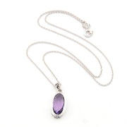 Necklace with a purple oval pendant on a white background