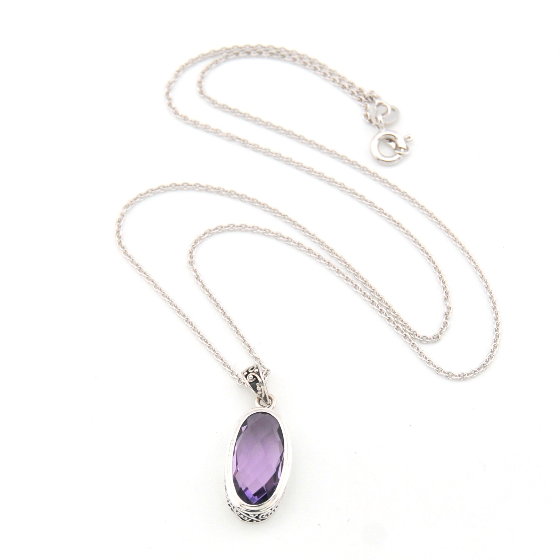 Necklace with a purple oval pendant on a white background