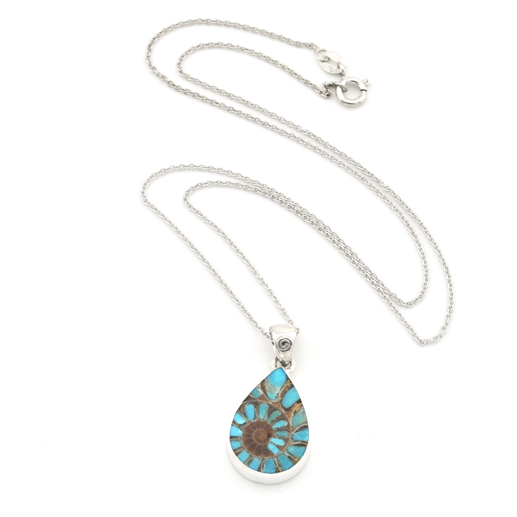 A silver teardrop pendant necklace featuring a turquoise and brown patterned stone, displayed on a clean white background.