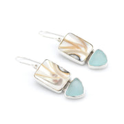 Pair of earrings with silver and light blue stone design on a white background