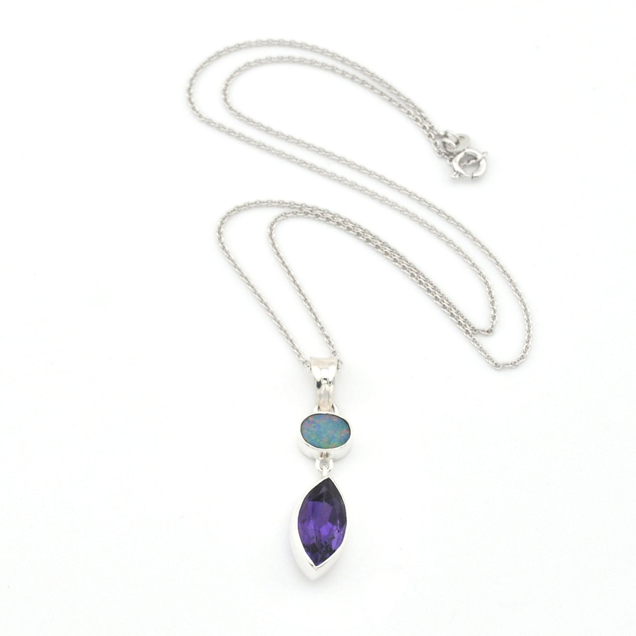 Necklace with a pendant featuring two gemstones on a white background