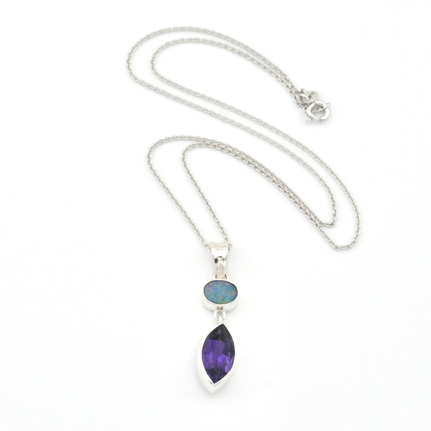 Necklace with a pendant featuring two gemstones on a white background