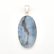 Blue stone pendant with silver frame on a white background