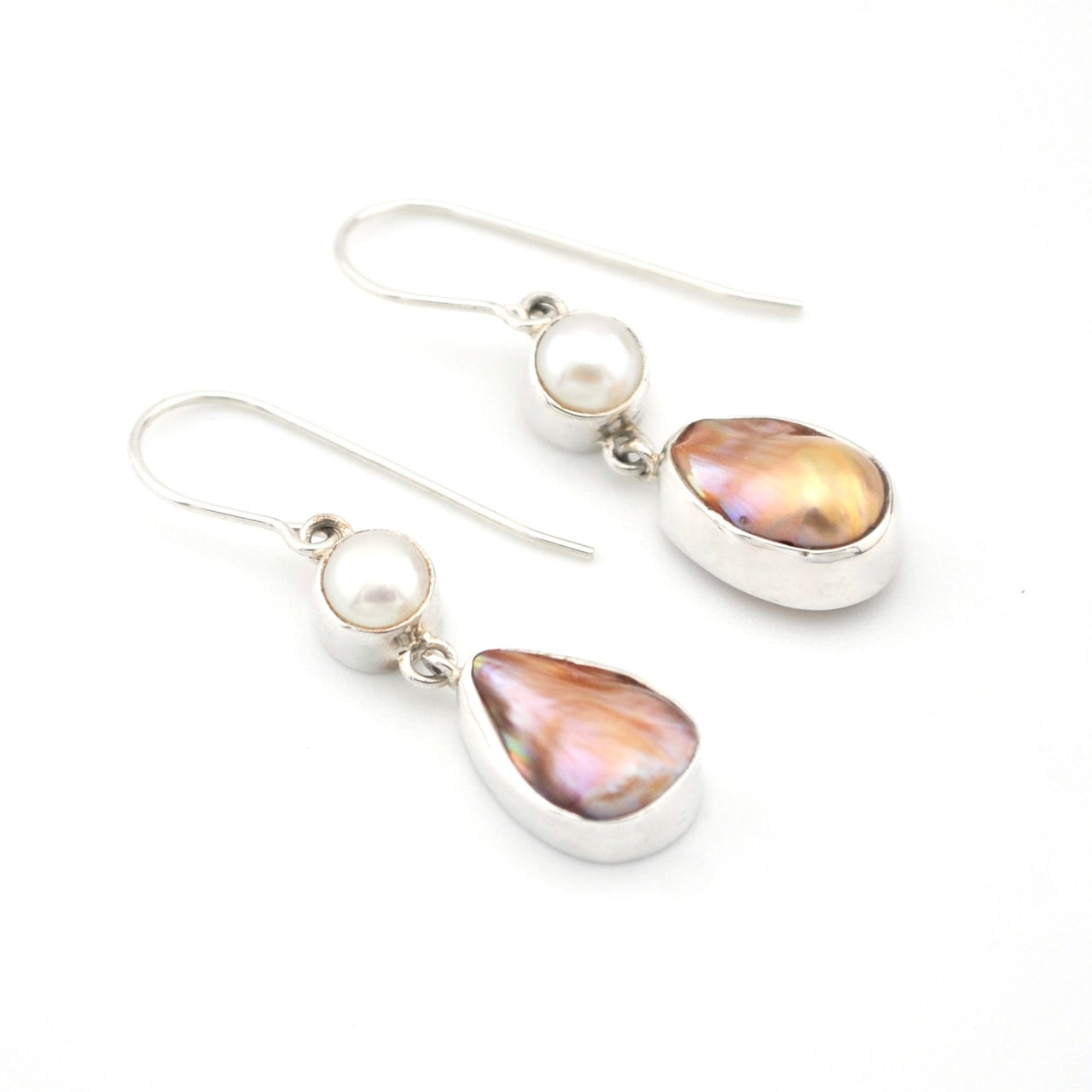 Pair of earrings with teardrop-shaped pearls on a white background