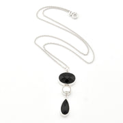 Necklace with black pendant on a white background