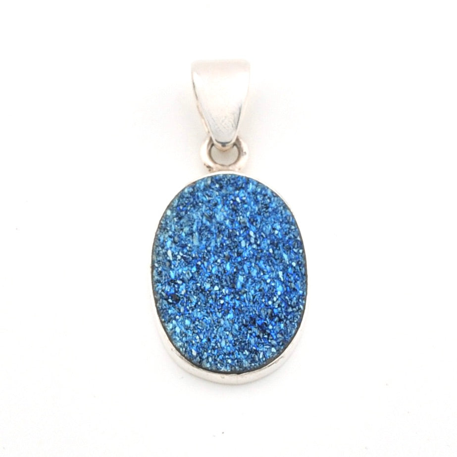 Blue druzy pendant on a white background