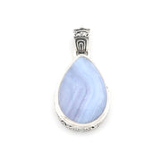 A teardrop-shaped pendant featuring a light blue and lavender marbled stone in a silver bezel setting with an ornate silver bail, shown on a plain white background.