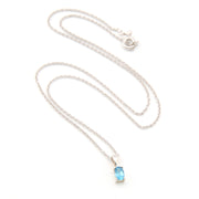 Necklace with a blue gemstone pendant on a white background