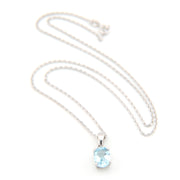 Silver necklace with a blue gemstone pendant on a white background