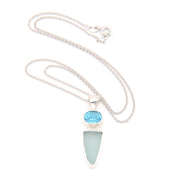 Necklace with a blue gemstone and light blue pendant on a white background