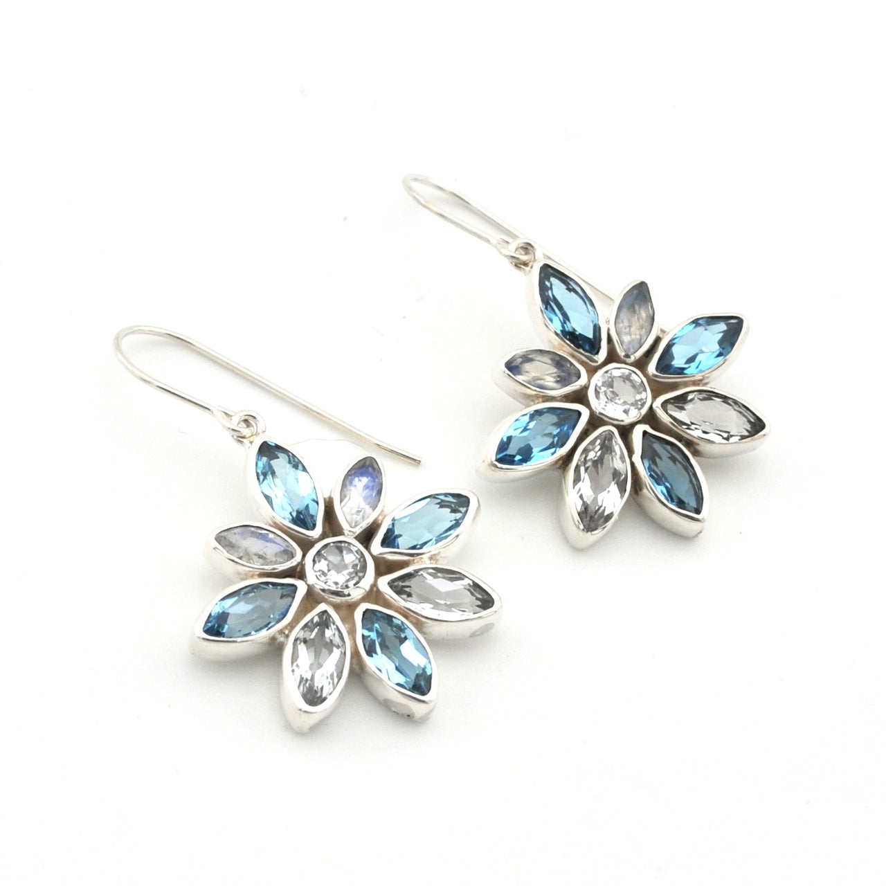 Handmade Sterling Silver Blue Topaz Moonstone Flower Earrings on white background