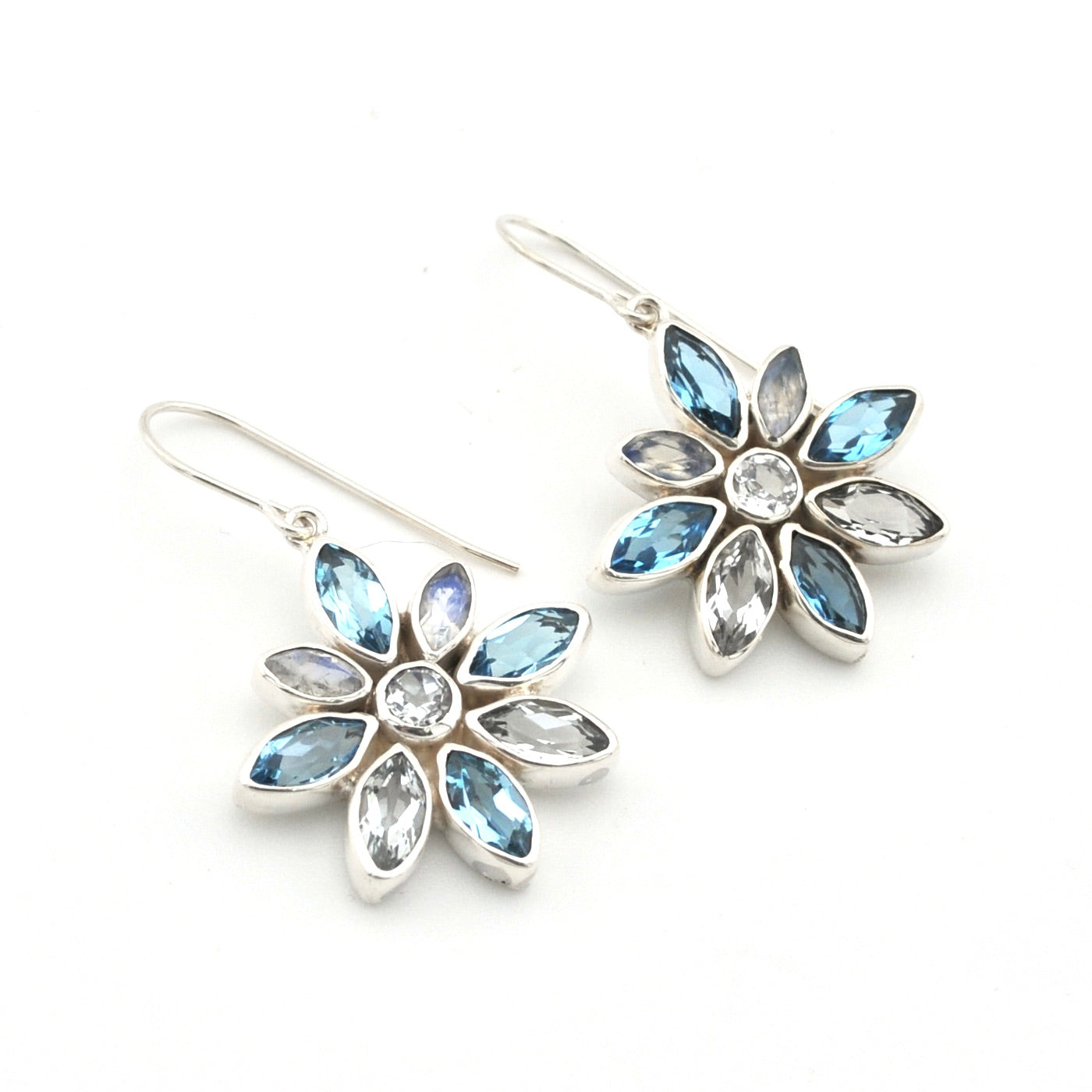 Handmade Sterling Silver Blue Topaz Moonstone Flower Earrings on white background