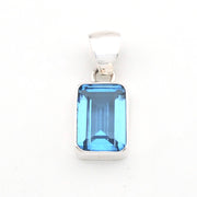 Blue gemstone pendant on a white background