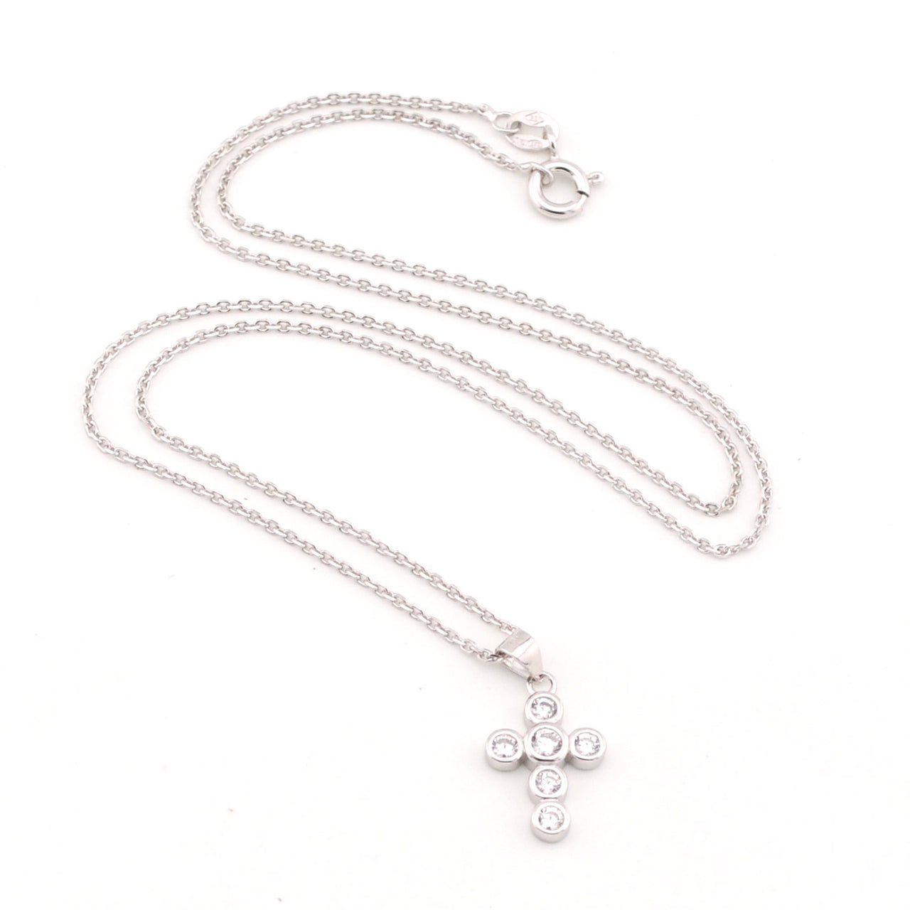 Silver necklace with a cross pendant on a white background