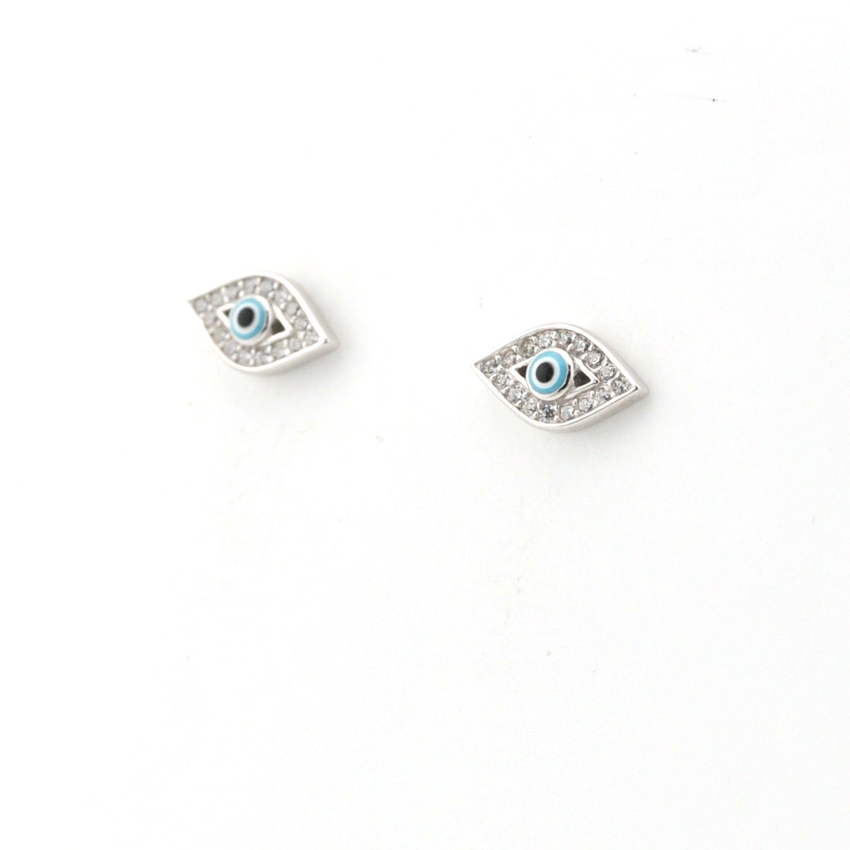 Pair of eye-shaped earrings on a white background