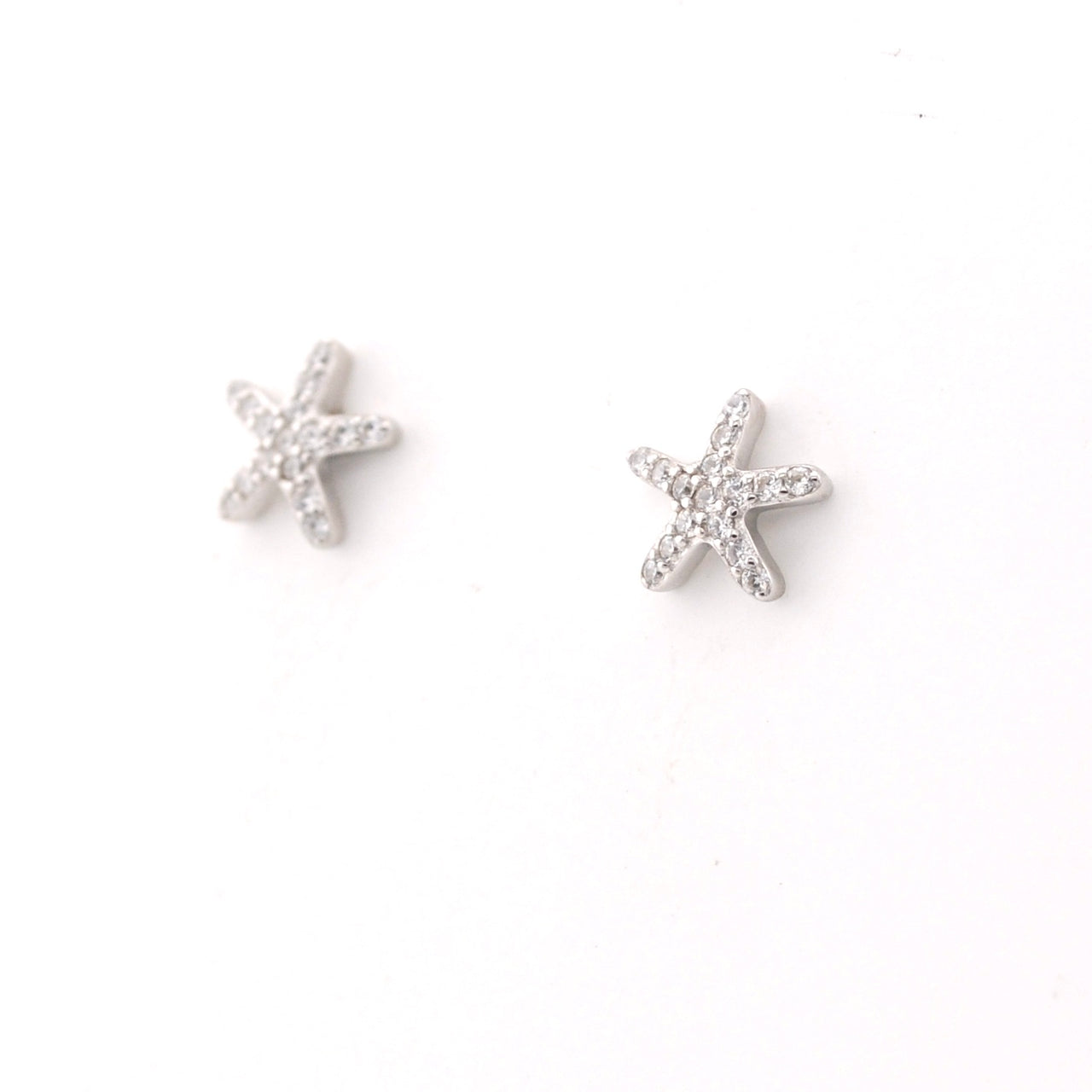 Starfish silver earrings on a white background