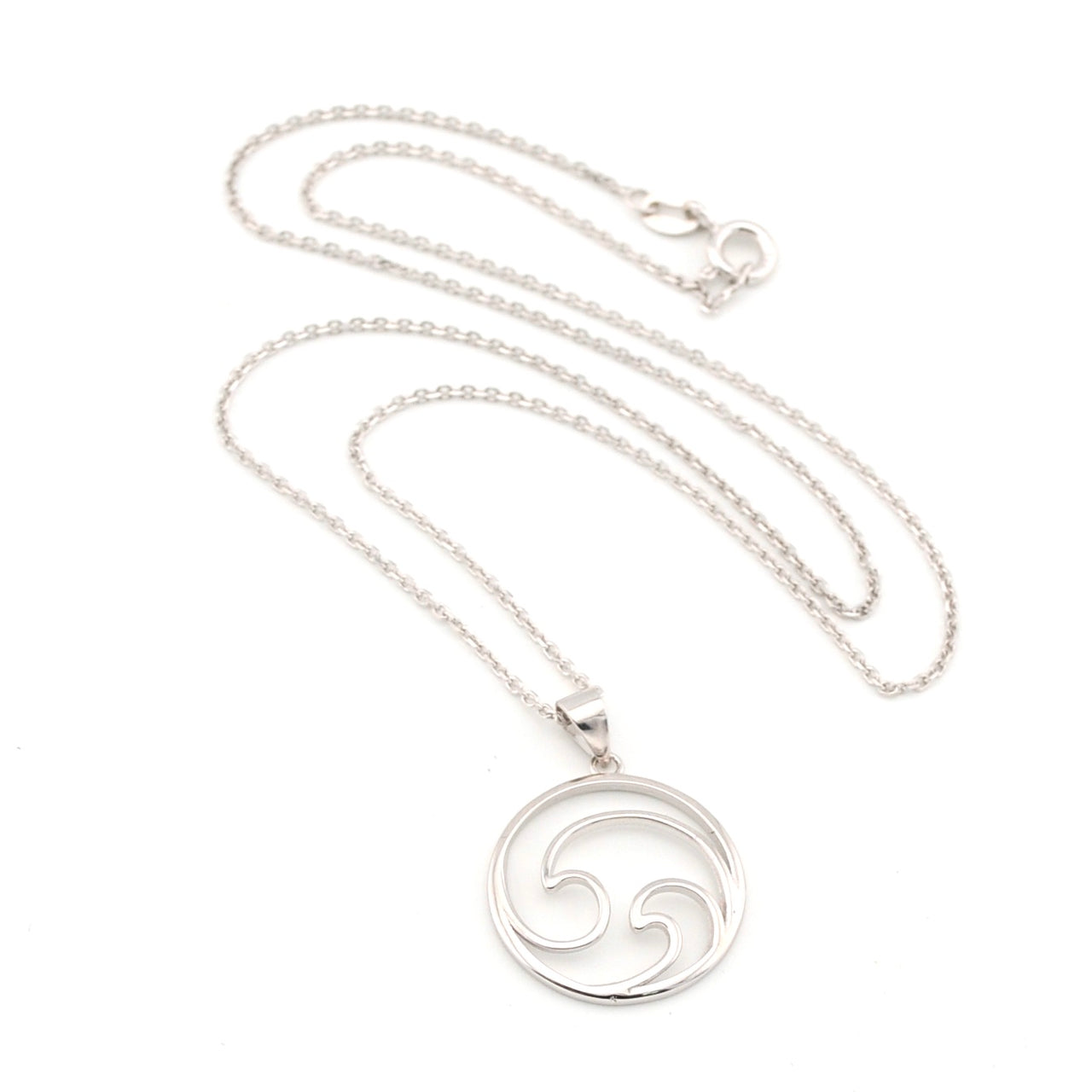 Silver necklace with a circular pendant on a white background