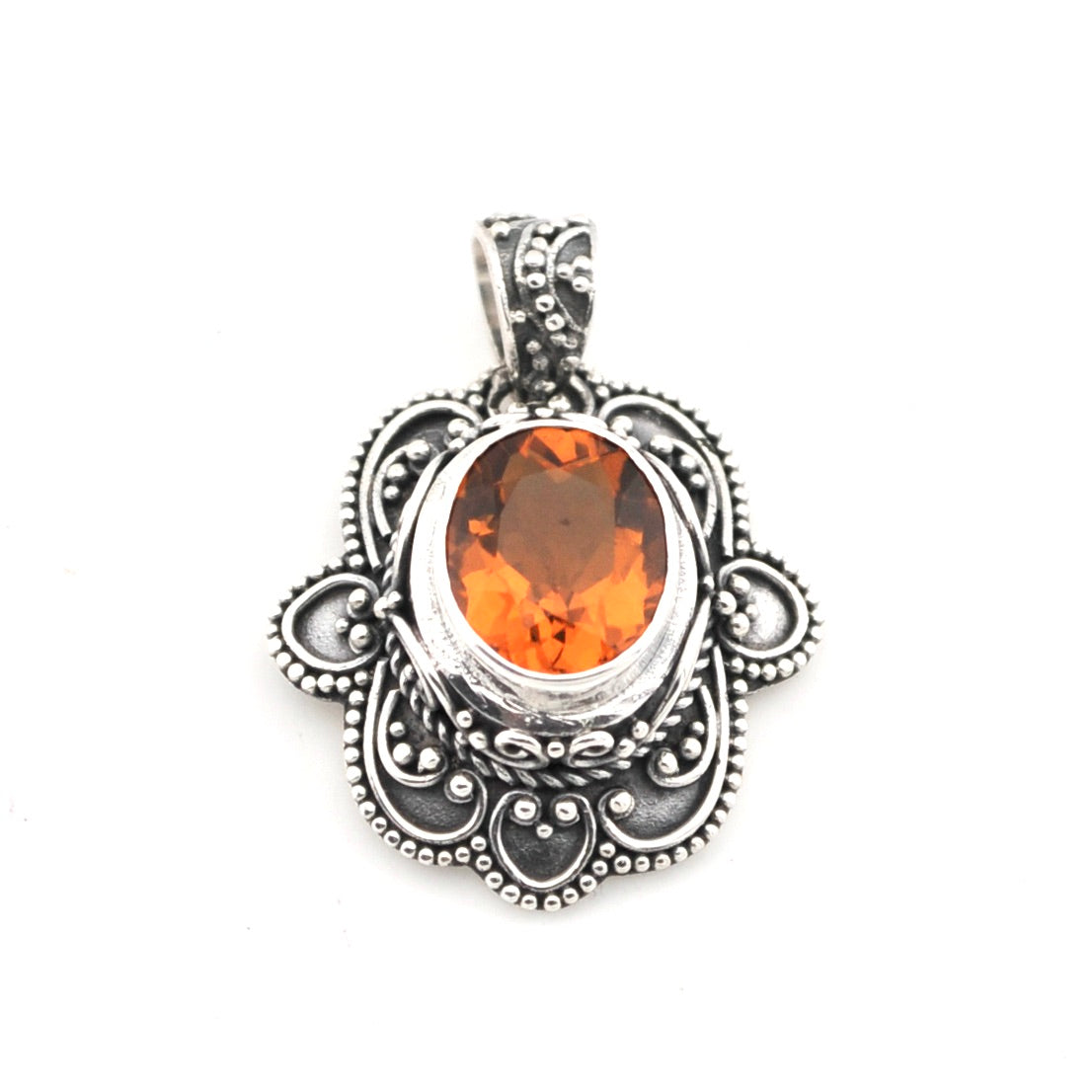 Silver pendant with an orange gemstone on a white background