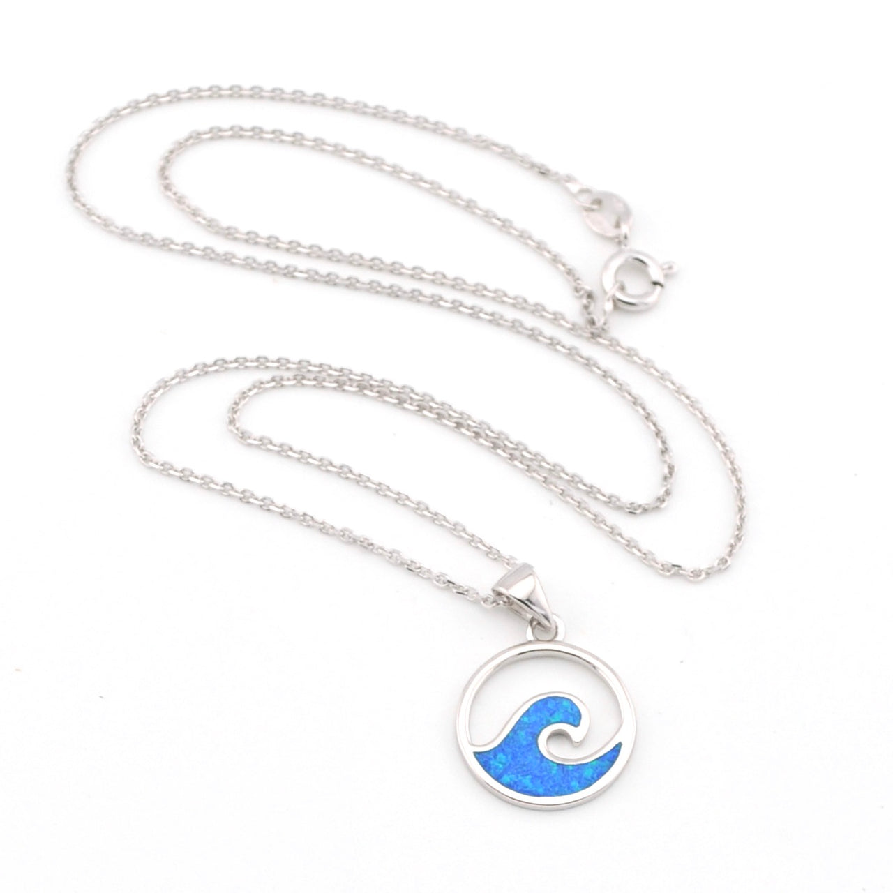 Necklace with a blue wave pendant on a white background