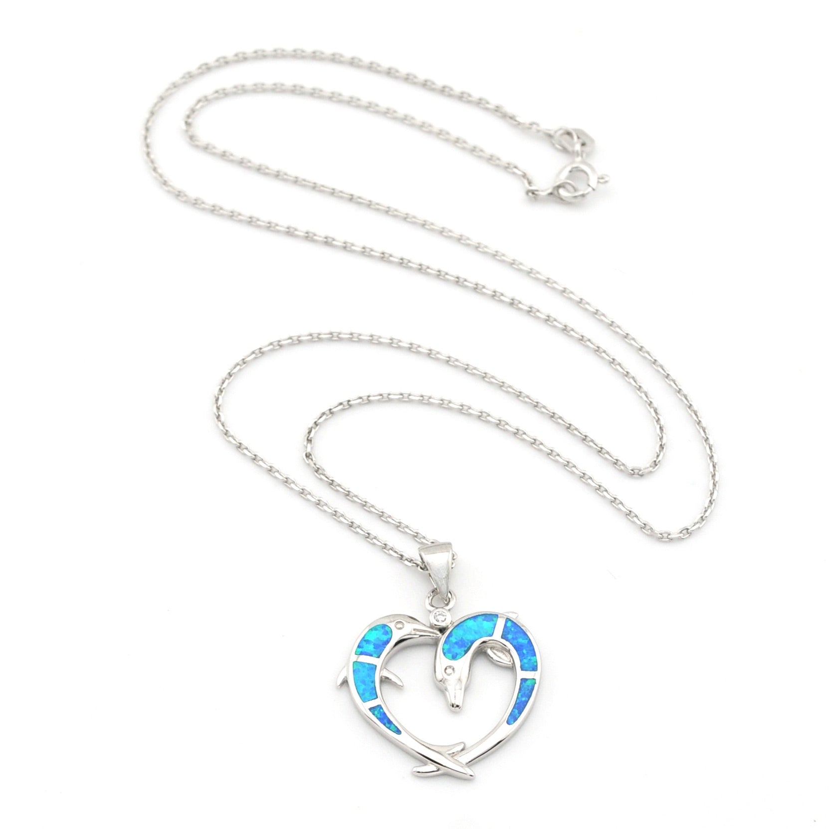 Heart-shaped pendant with blue interior on a silver chain against a white background