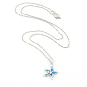 Star-shaped pendant necklace with blue accents on a white background