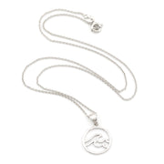 Silver necklace with a wave pendant on a white background