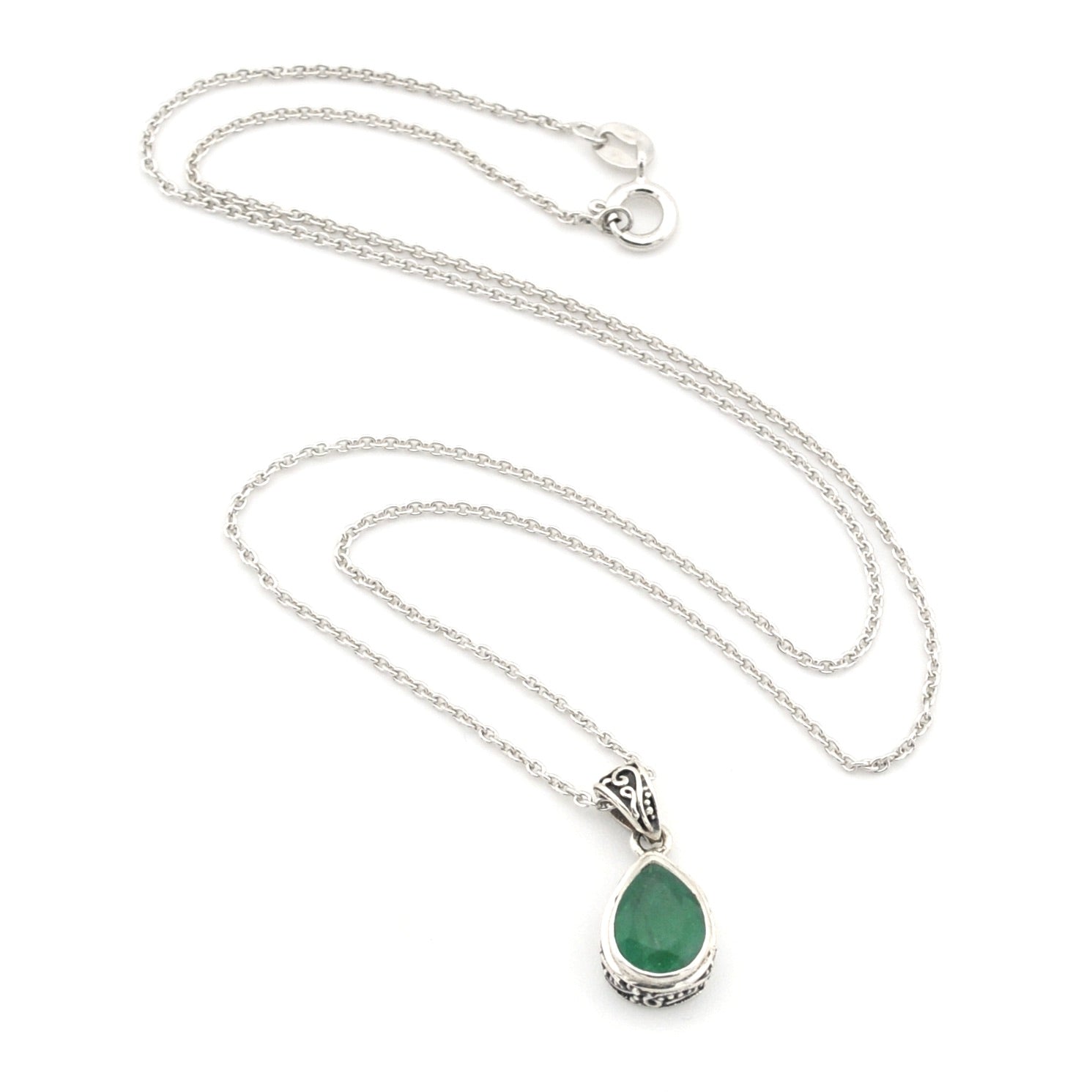 Silver necklace with a green teardrop pendant on a white background