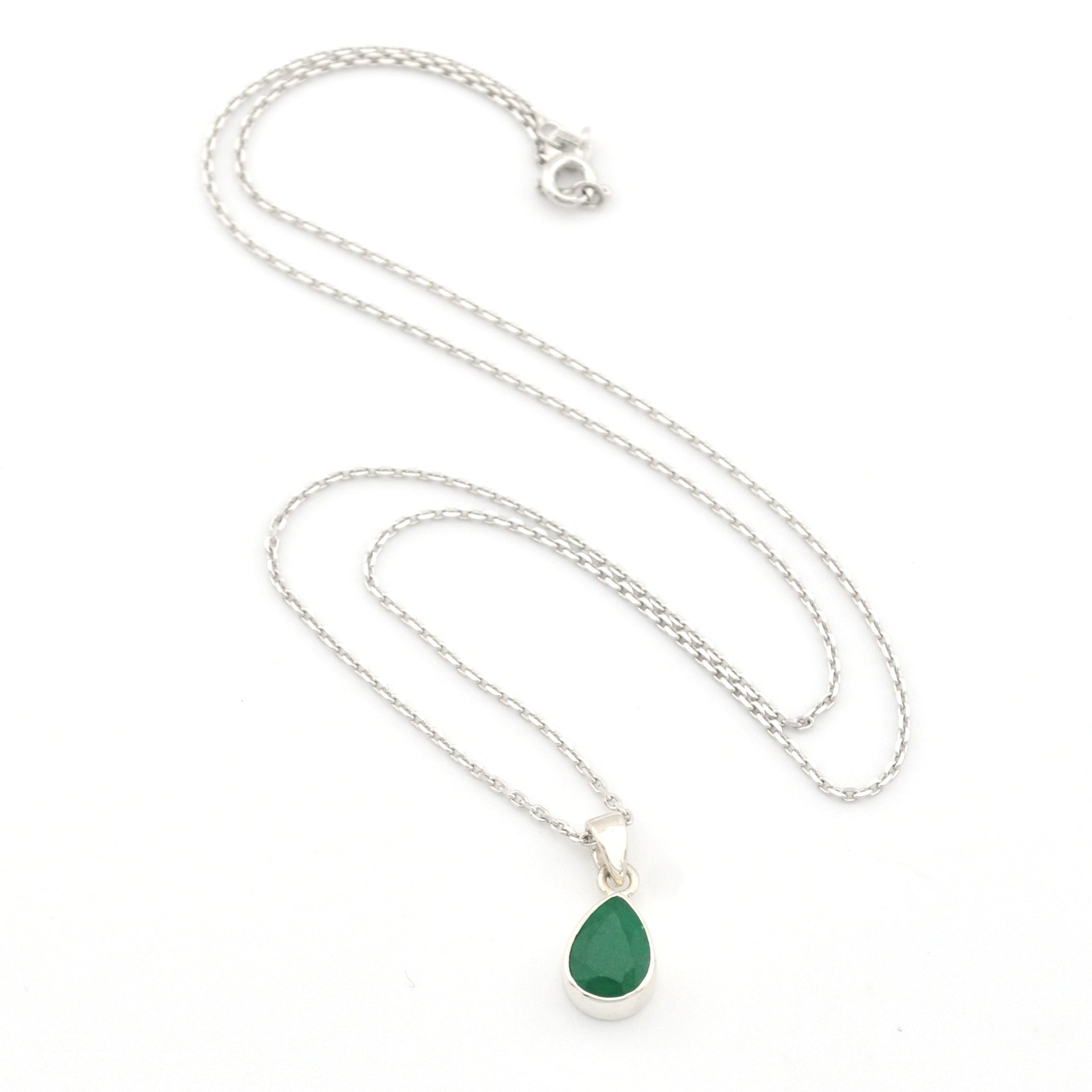 Necklace with a green teardrop pendant on a white background