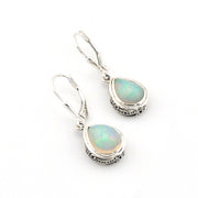 Opal earrings with silver hooks on a white background