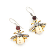 Bee-shaped earrings with gold and silver details on a white background